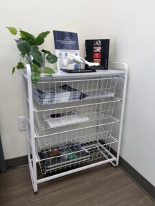 White metal card with plants in waiting area