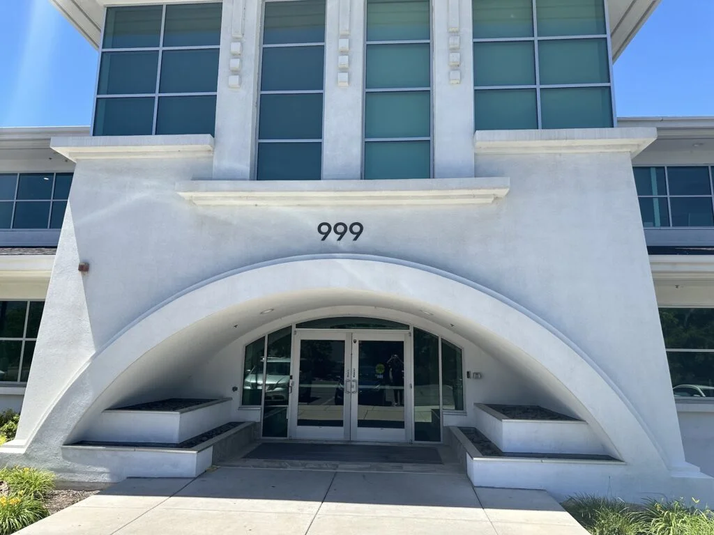 Advanced Foot and Ankle Clinic Holladay clinic, white building with large arch over doors
