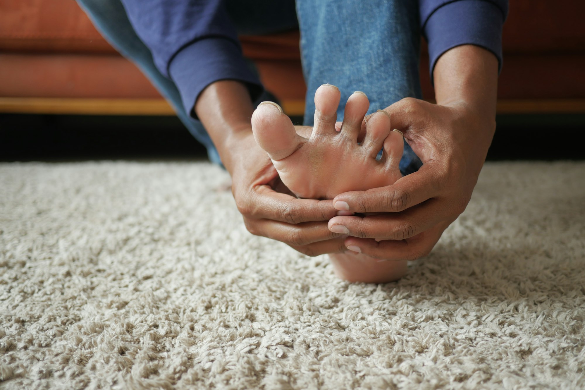 Close up on young man suffering feet pain