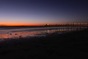 Picturesque view of the Oceanside Pier in California, illuminated by a stunning sunset