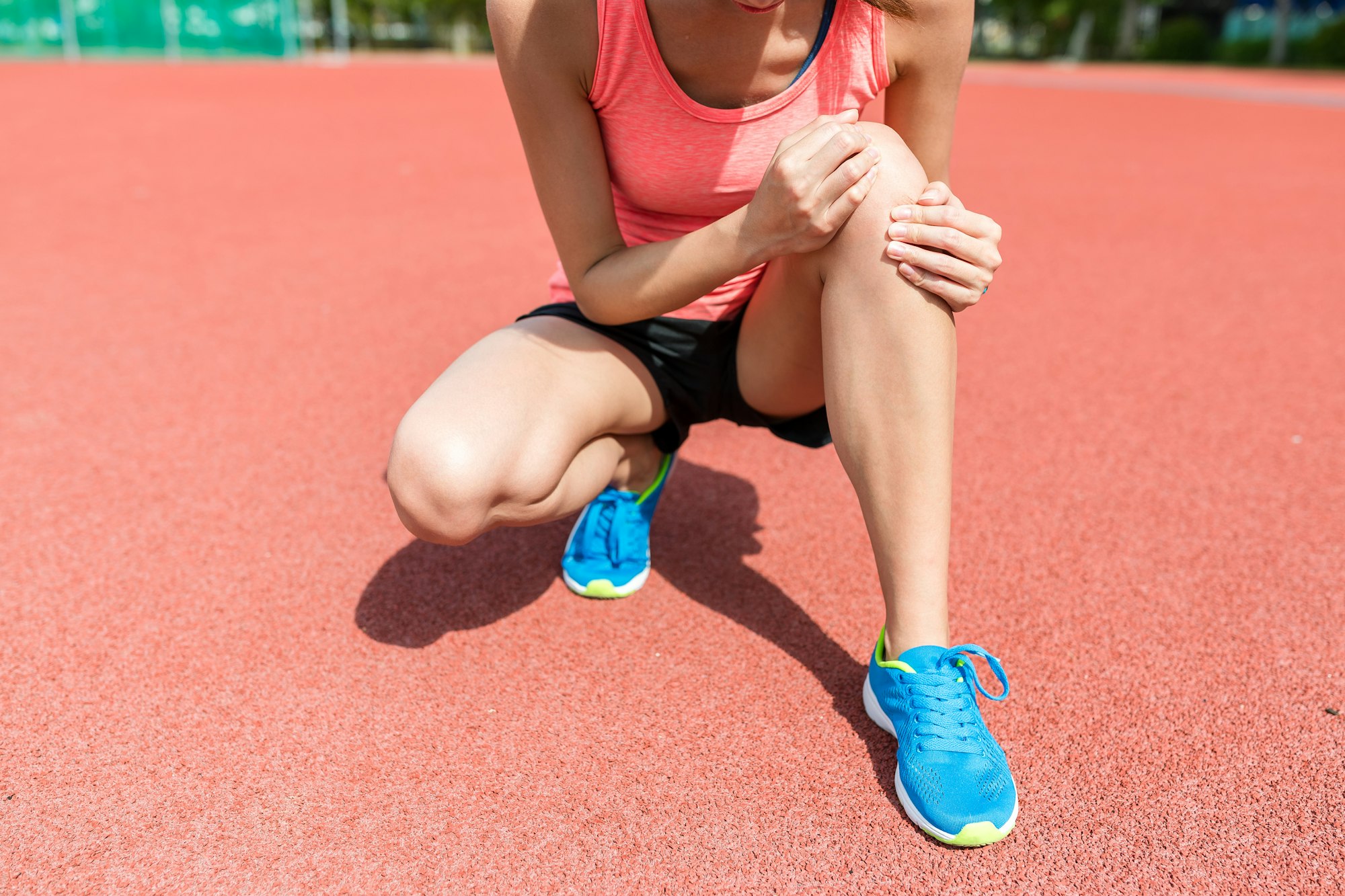 Knee Pain Treatment - Woman feeling pain on knee