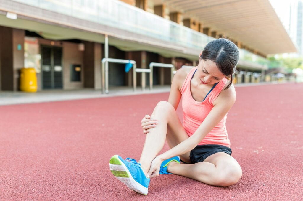 Woman having ankle sprain